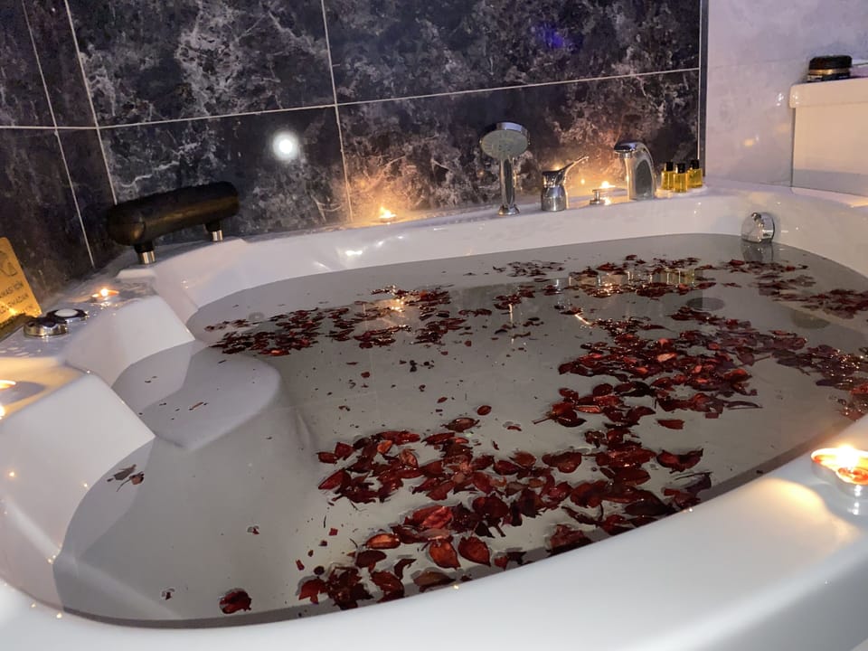 Premium Double Room | Bathroom | Combined shower/tub, jetted tub, rainfall showerhead