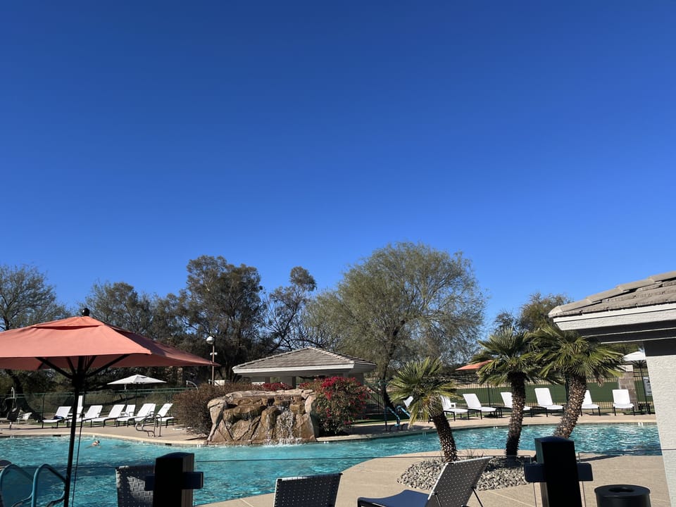 Heated pool w many lounge chairs