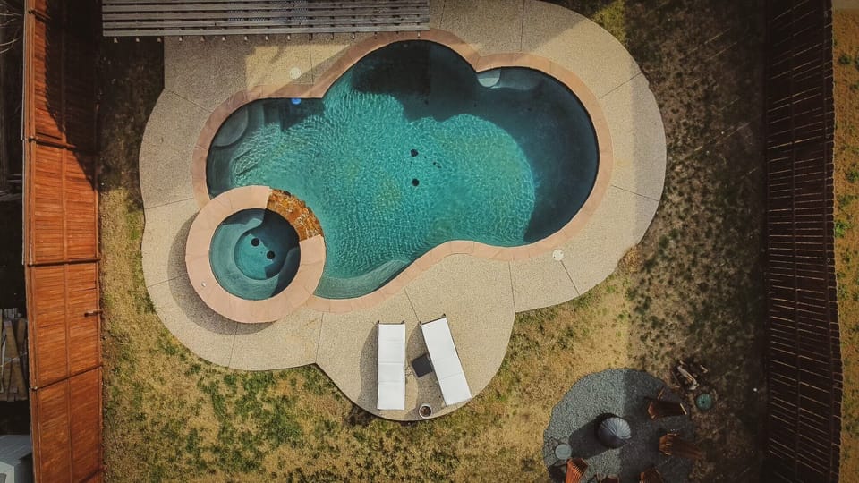 Backyard with pool, hot tub, fire pit, grill and pergola! Come relax and enjoy!
