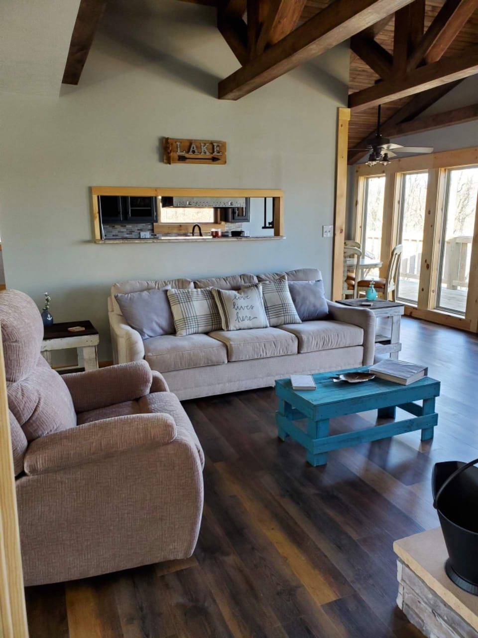 queen sleeper sofa, power recliner in living room. millwork on ceiling 