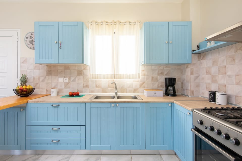 Villa | Private kitchen | Fridge, microwave, oven, stovetop