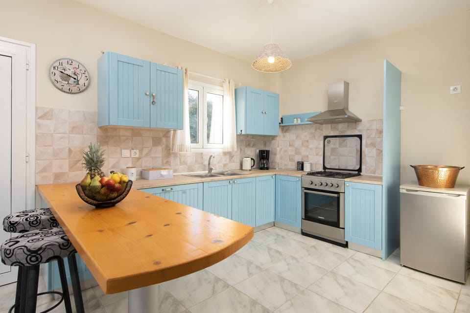 Villa | Private kitchen | Fridge, microwave, oven, stovetop