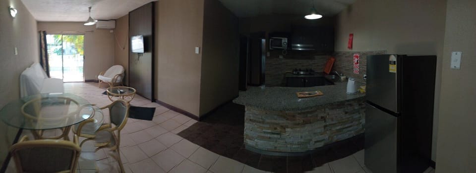 Deluxe Apartment | Living area | 32-inch LED TV with cable channels