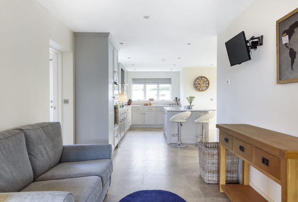 All Views, Burton Bradstock: View from the snug area of the kitchen through to the breakfast island