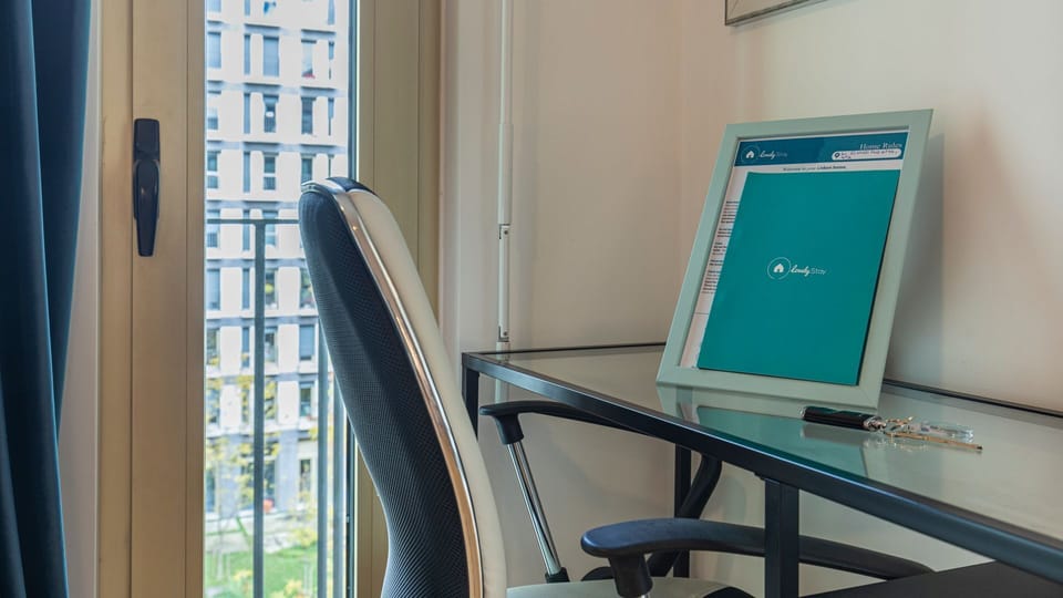 Dedicated workspace beside the balcony, ideal for remote work or planning your Lisbon adventures in comfort. #RemoteWork #Workstation #DigitalNomad #BalconyView #LisbonLifestyle #Portugal #PT #Lisbon
