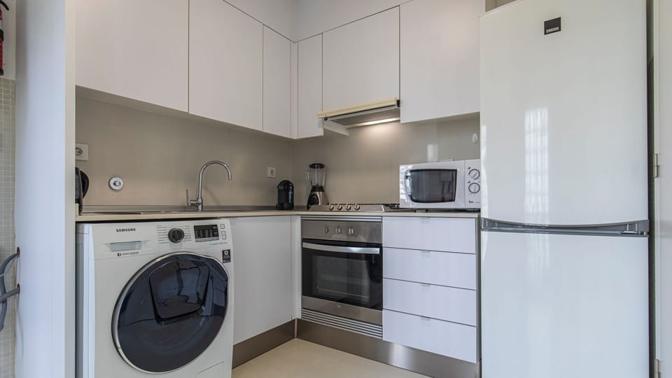 Fully equipped contemporary kitchen with washing machine, coffee machine, and everything needed for a convenient city stay. #ModernKitchen #FullyEquipped #HomeAwayFromHome #CityApartment #TravelEssentials #Portugal #PT #Lisbon