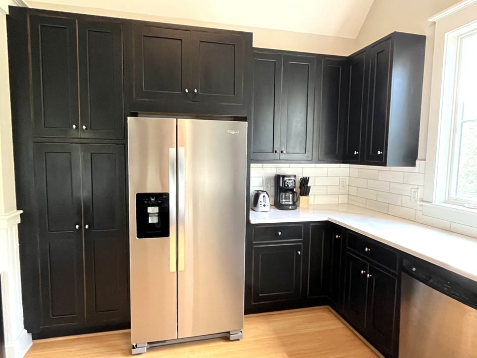 Large pantry to left of refrigerator, lots of counter space.