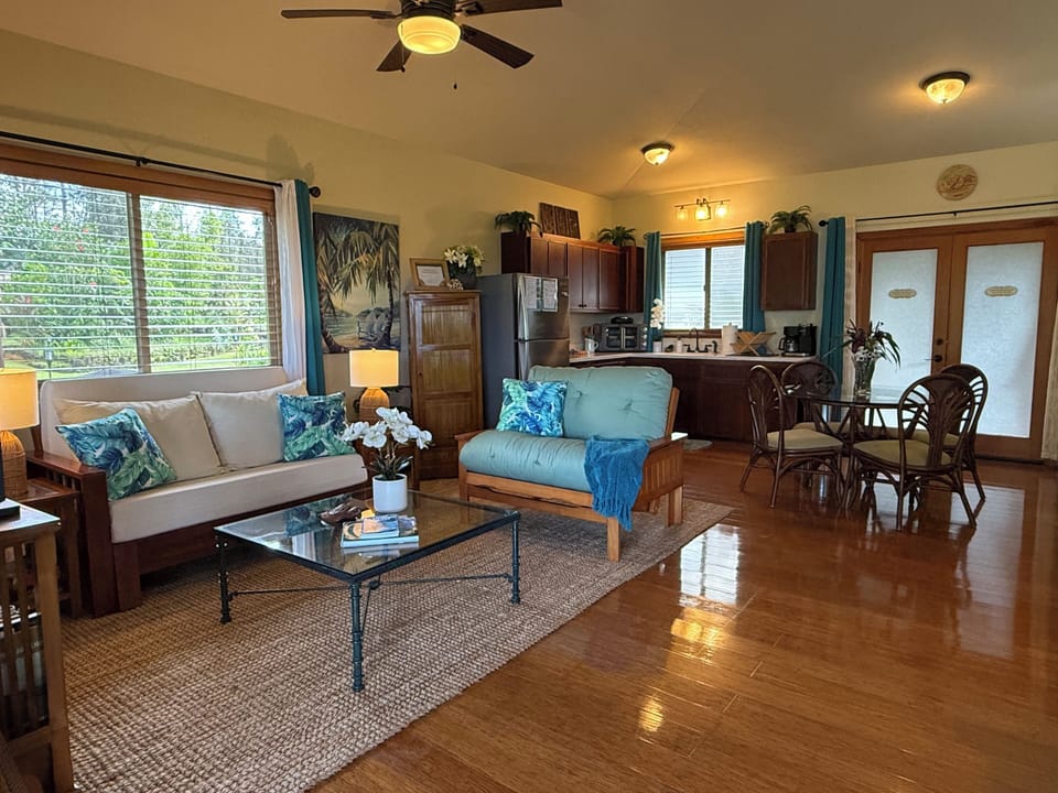 View of living room, kitchen, and dining spaces.