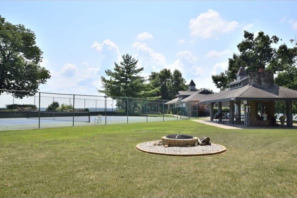 Community pavilion, fire pit, and tennis courts