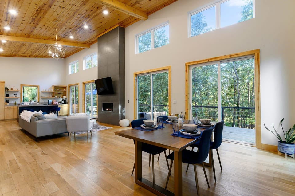 Living Room: Sunlit space with modern decor, perfect for relaxing and stunning nature views!