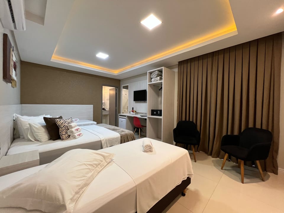 Premium Quadruple Room | In-room safe, desk, laptop workspace, blackout drapes