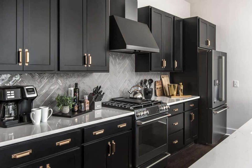 Fully equipped kitchen with stainless steel appliances.