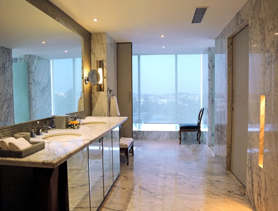 Suite, 1 King Bed (Regency) | Bathroom | Combined shower/tub, deep soaking tub, designer toiletries, hair dryer