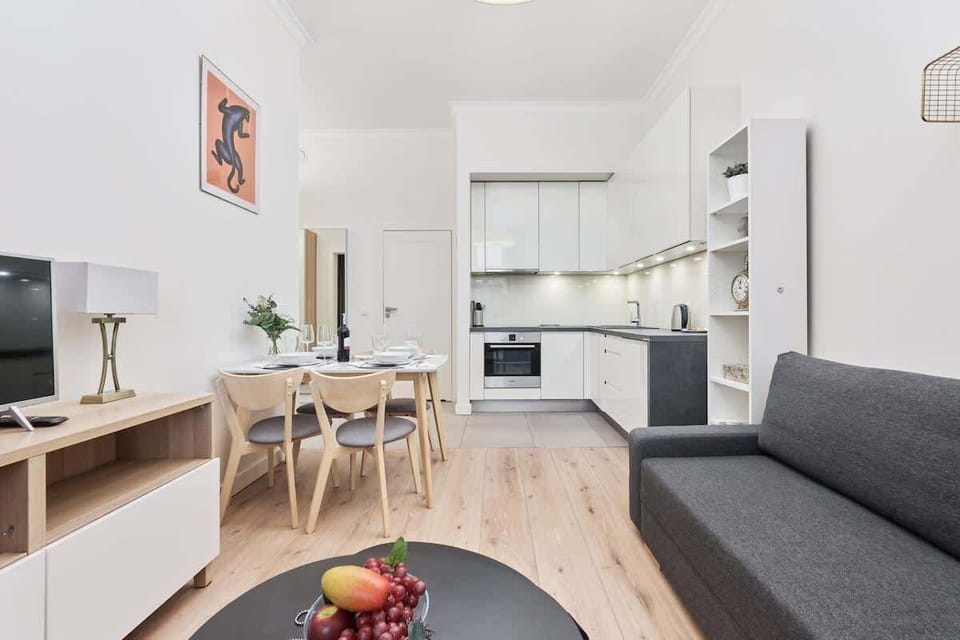 The elegant living room featuring a double sofa bed.