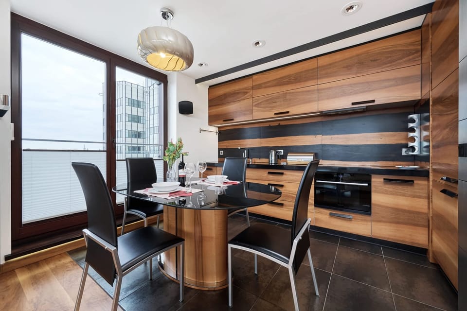 Dining area setup with a table prepared for meals.
