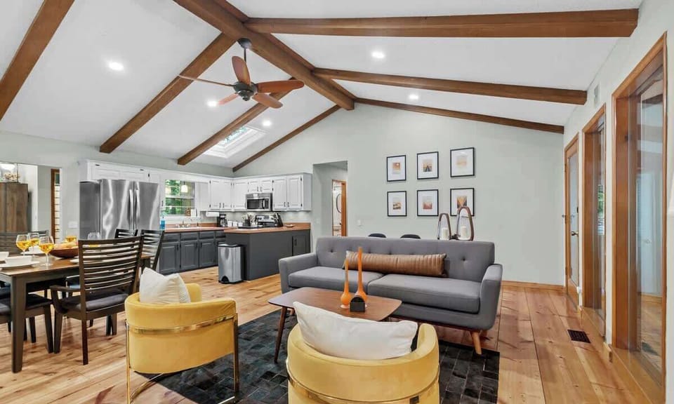 On the opposite side of the dining table, you'll see our first lounge area featuring a working fireplace. This is the perfect area to curl up with a good book or dive into a great conversation.