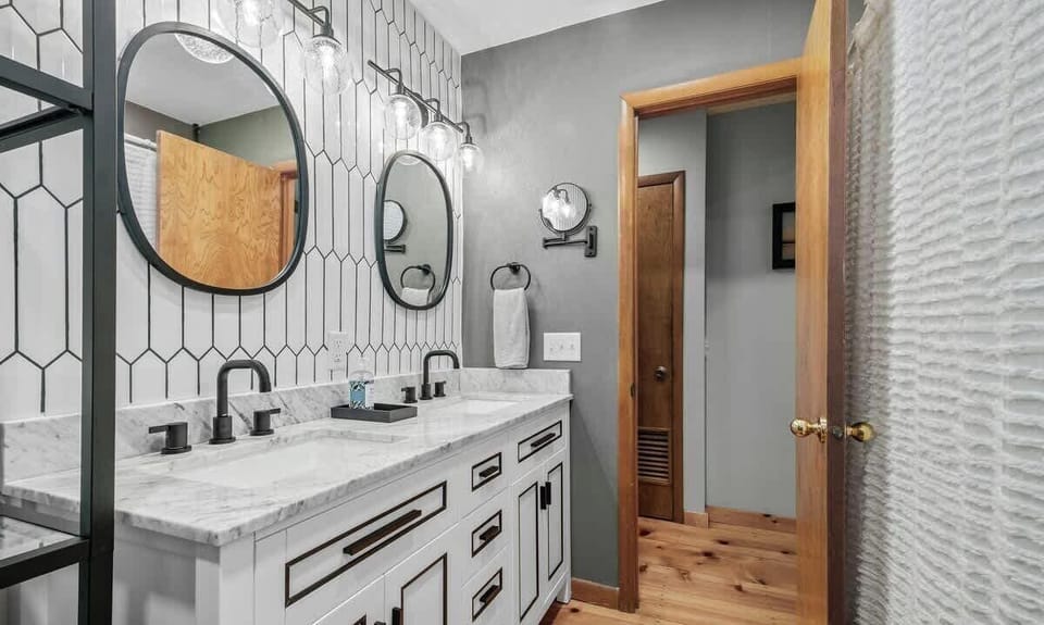 This beautiful, hand-tiled bathroom can be accessed through the hallway by our first two bedrooms.
