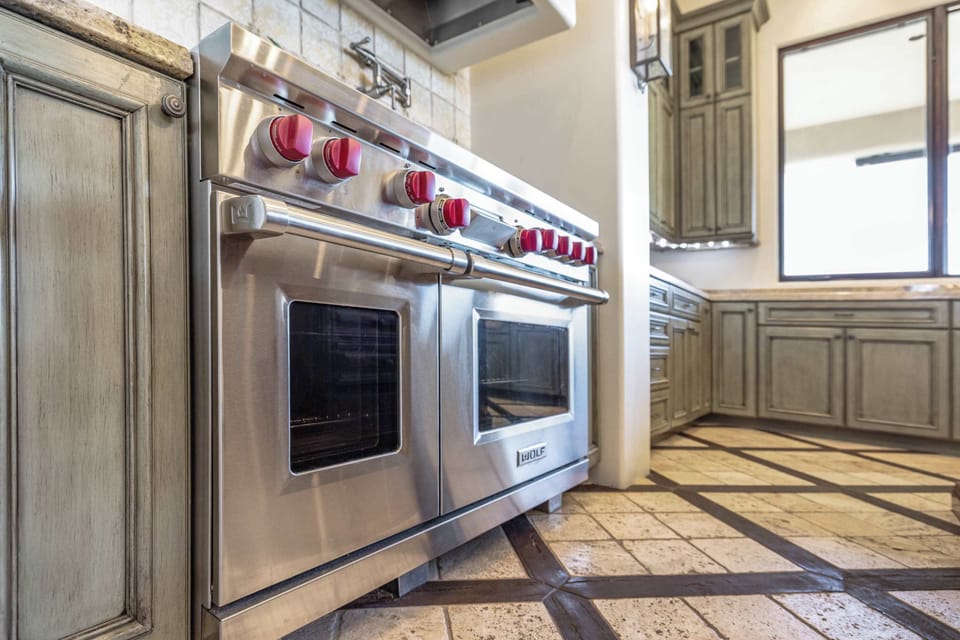 Premium Wolf double ovens and ample storage ensure you have everything needed 