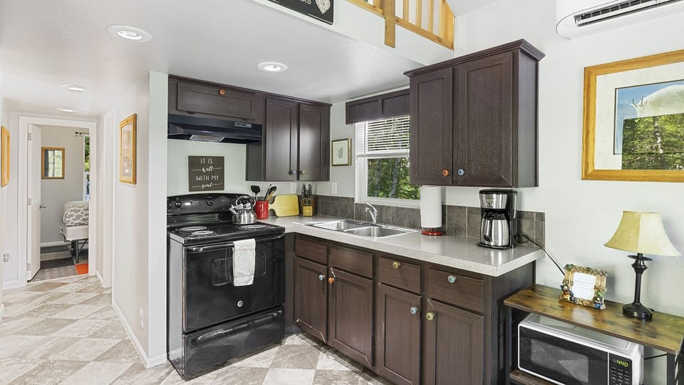 Fully stocked kitchen with coffee maker and ample counter space