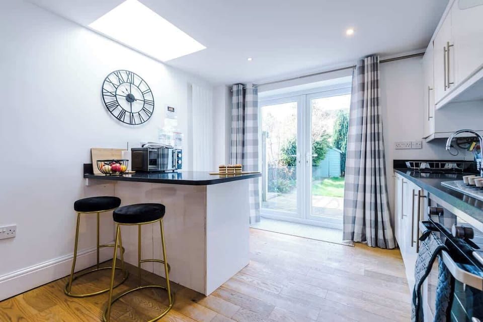 Open plan kitchen/dining area with breakfast bar and all the necessities to cook an array of meals in the evenings after a long day exploring or working in Chester.