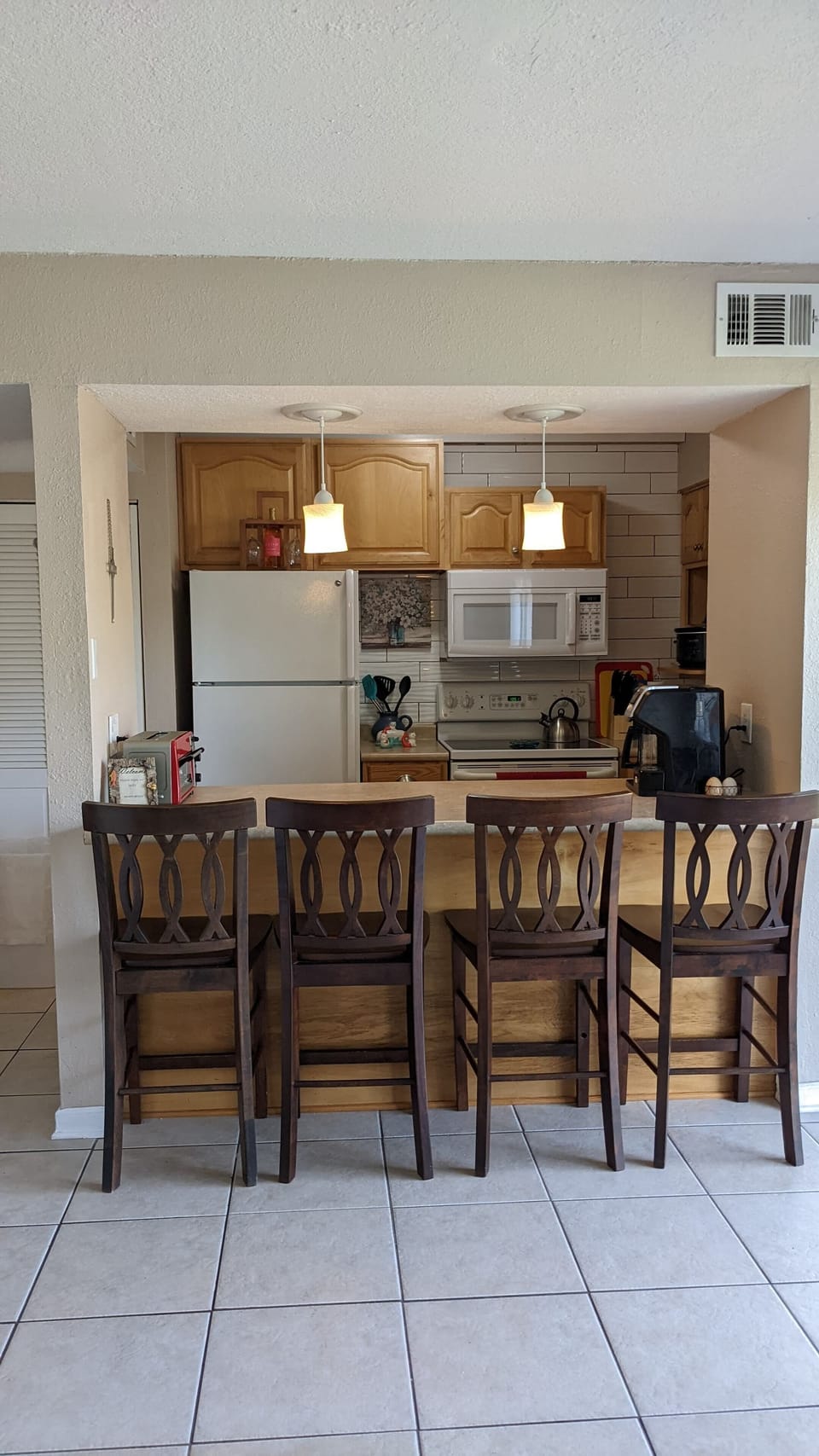 Looking from the living room to the kitchen