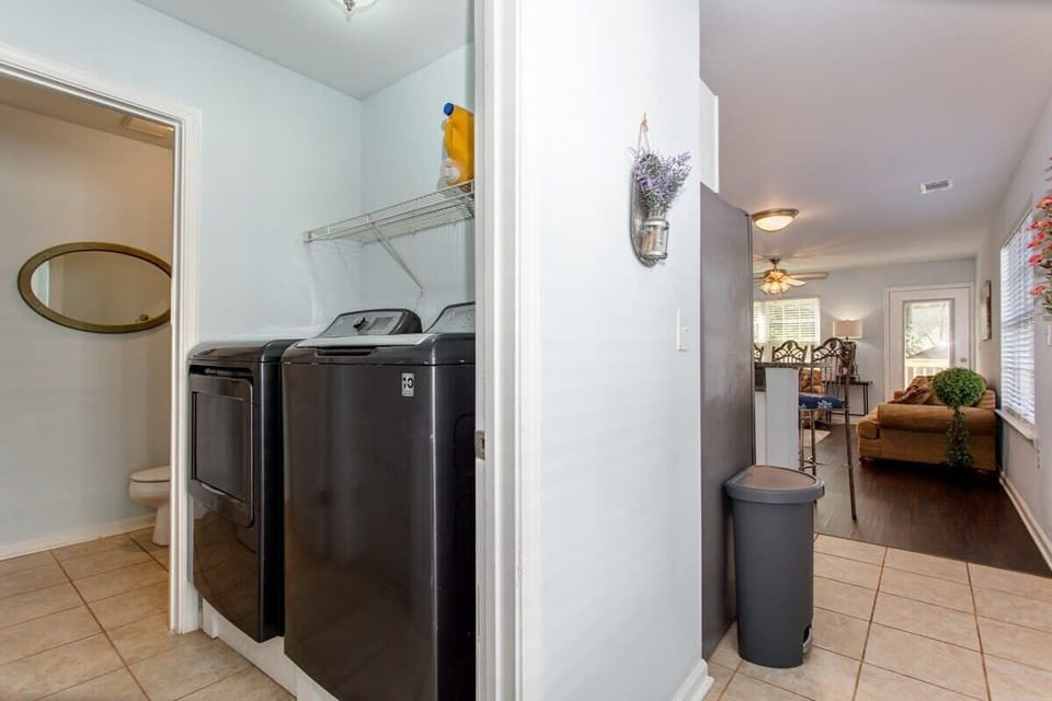 Laundry just off the downstairs kitchen area in side front door.