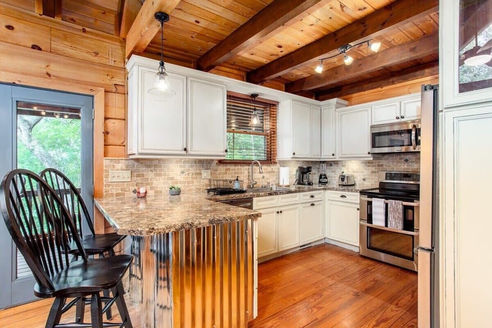 Simple but elegant kitchen with all the essentials and seating for two at the bar area.