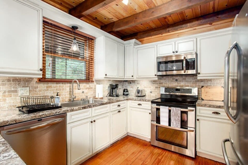 Beautifully updated kitchen with granite countertops.