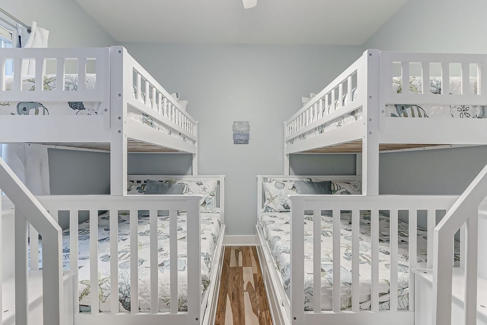 Two single over full bunk beds. Window includes blackout curtains. 