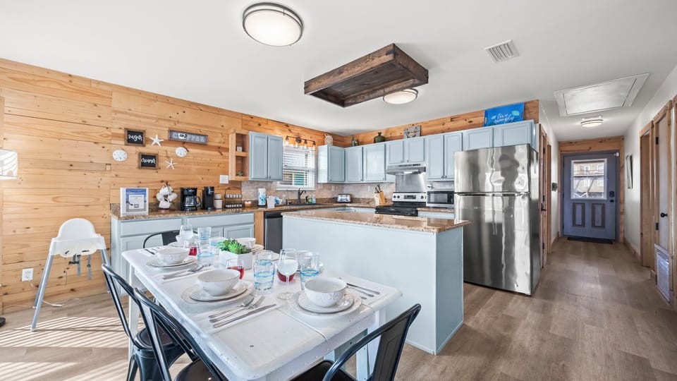 Open-concept kitchen and dining area, designed for seamless cooking and entertaining.