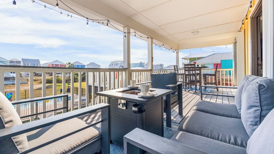 Enjoy the back deck with cozy evening string lights, firepit, outdoor dining, and comfortable seating areas—perfect for relaxing nights.