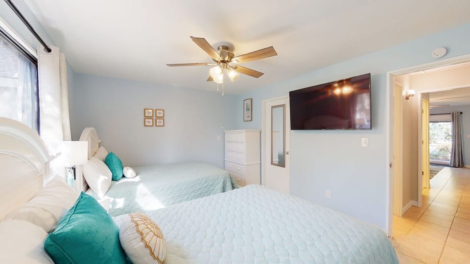 Guest Bedroom with Wall-Mount Smart TV
