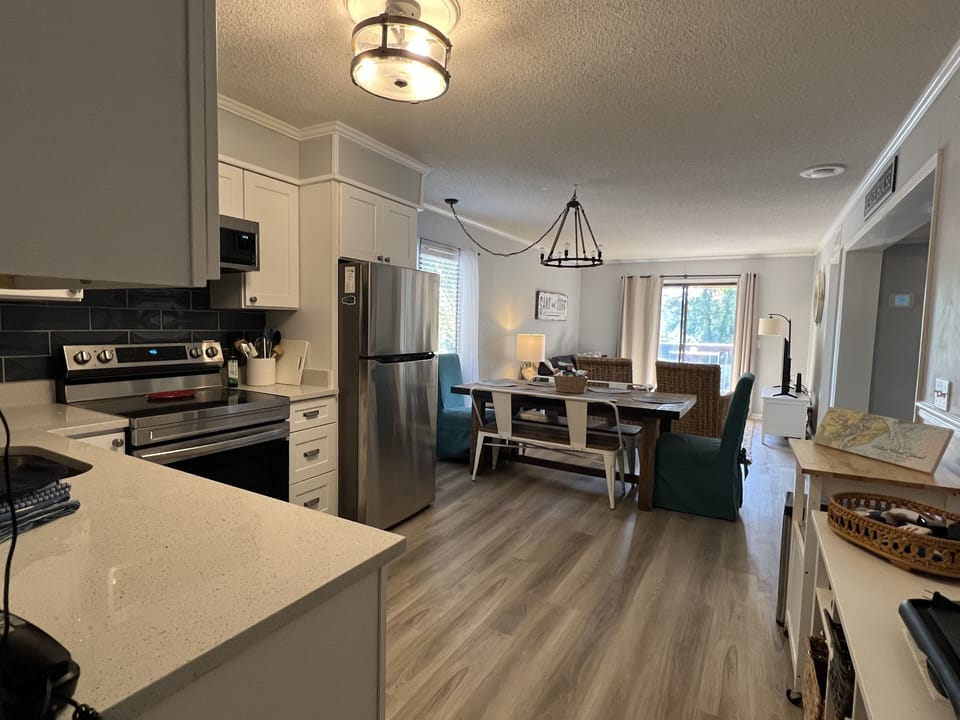 New flooring in kitchen/living room   Large rectangular kitchen table 
