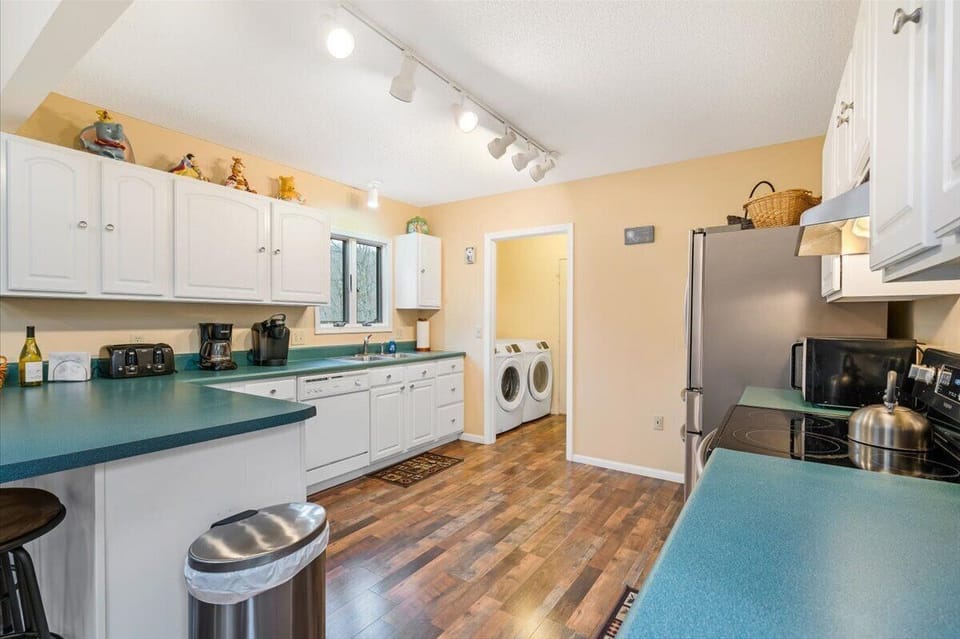 Kitchen with laundry room access. (Second Dryer is in the garage)