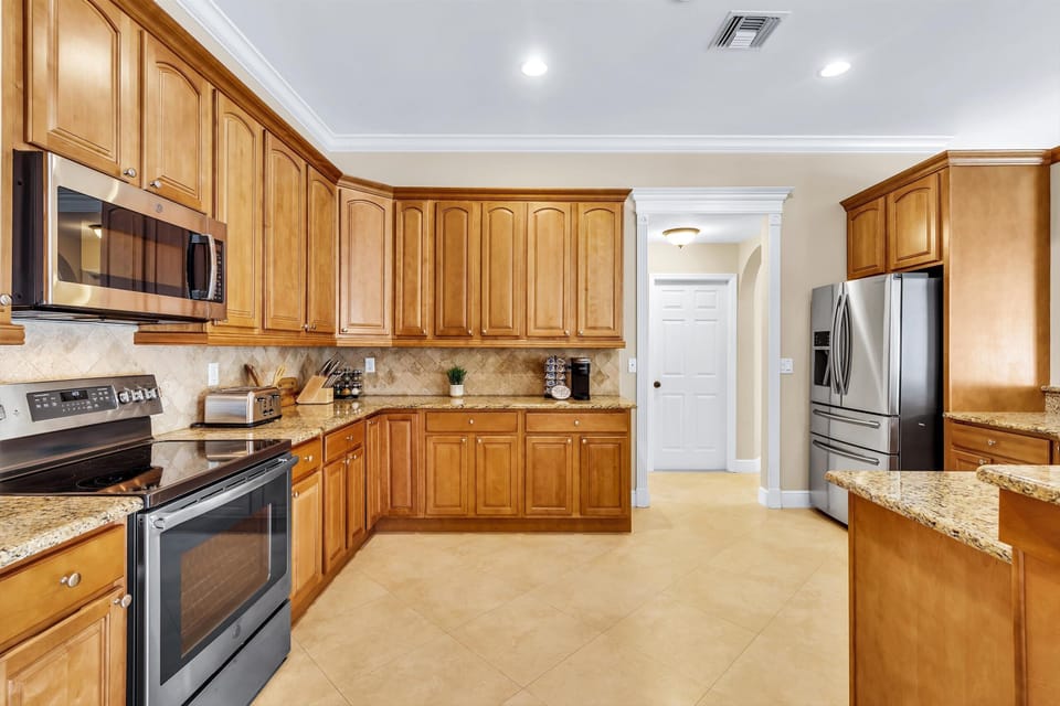 Cook in style with this spacious kitchen and stunning granite countertops. 
