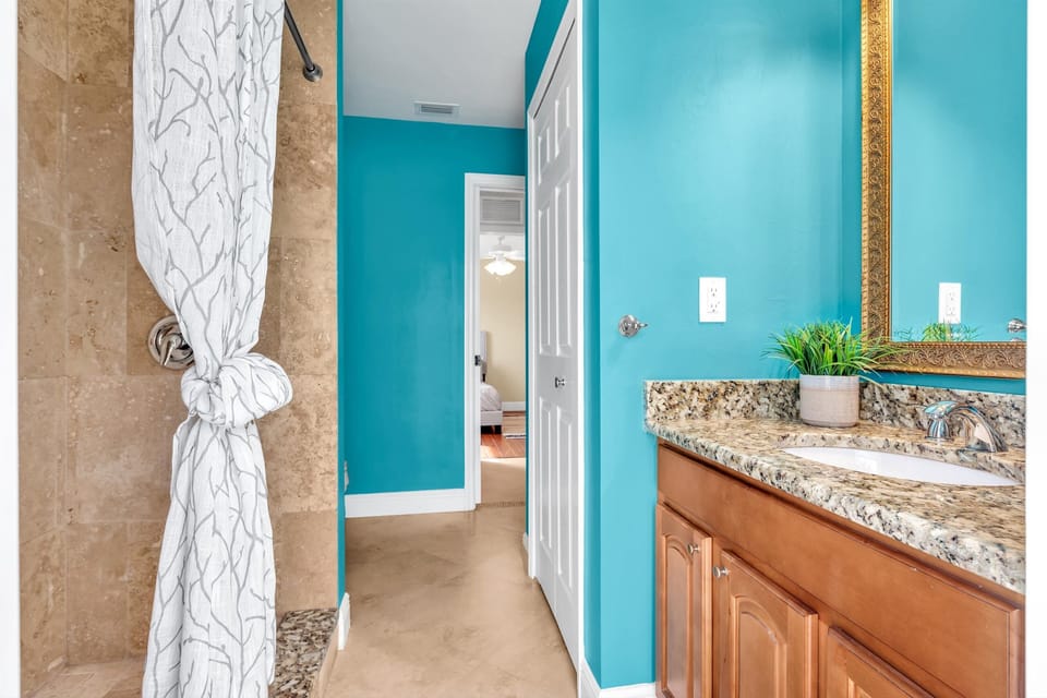 Stylish guest bathroom featuring a sleek custom walk-in shower!