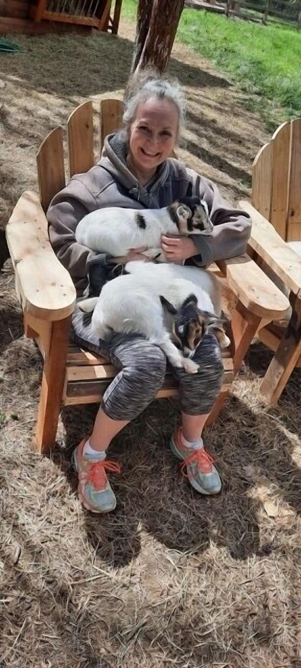 Angie our guest holding baby goats.