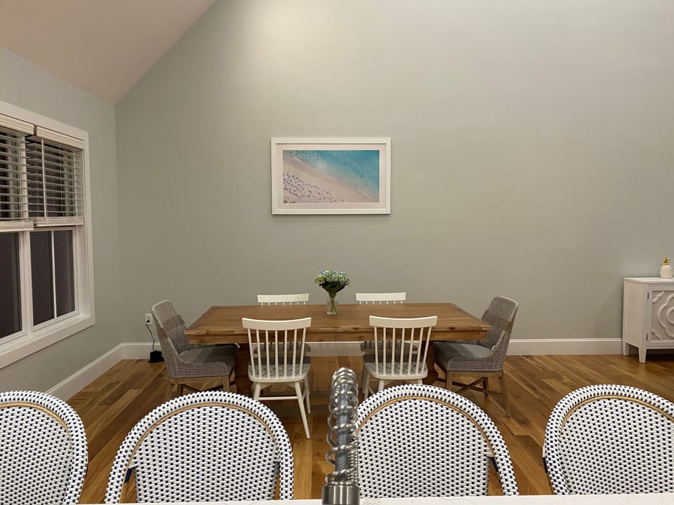 Dining table w/ open concept to kitchen. Seat 6 at dining table and 4 at island.