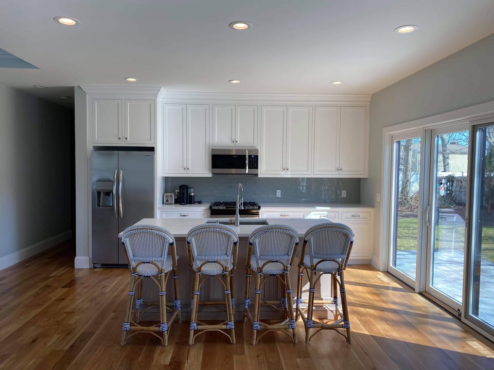 Modern kitchen w/ stainless appliances and quartz counters