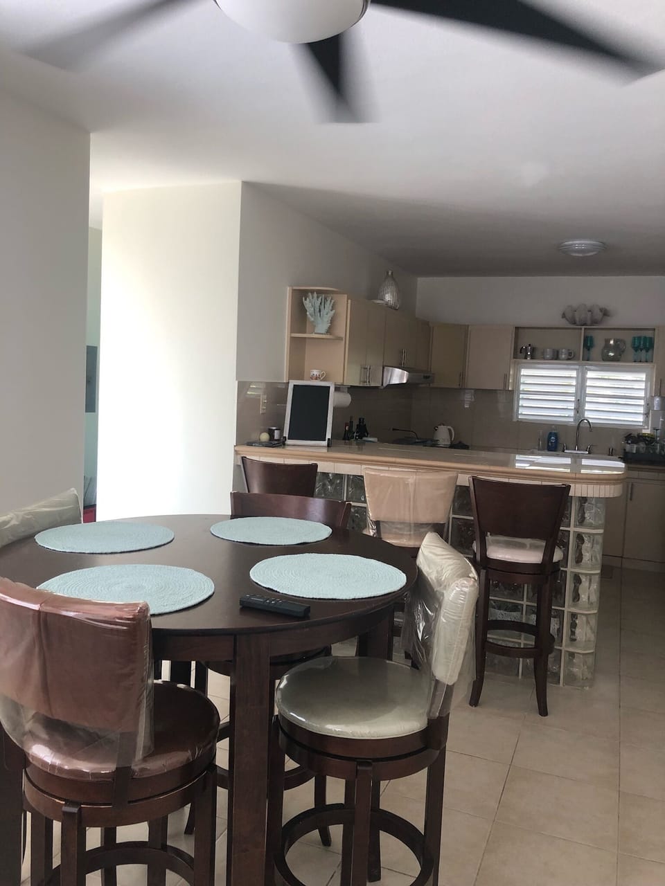 Dining area with ceilings fans through out home