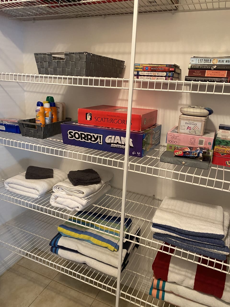 The hall closet includes pool towels, board games, puzzles, books.