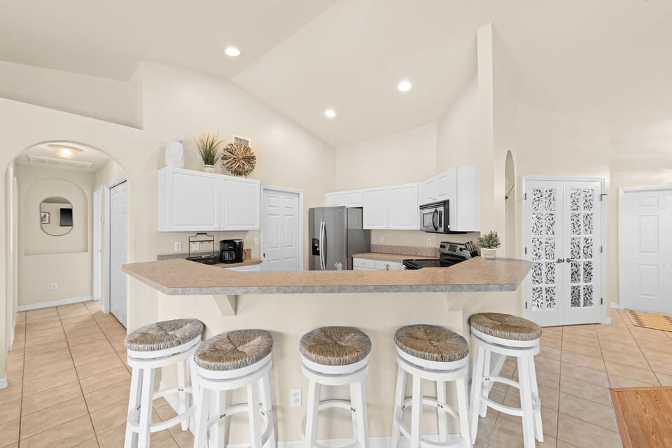 Fully stocked kitchen for all your cooking needs and the breakfast bar seats 5.