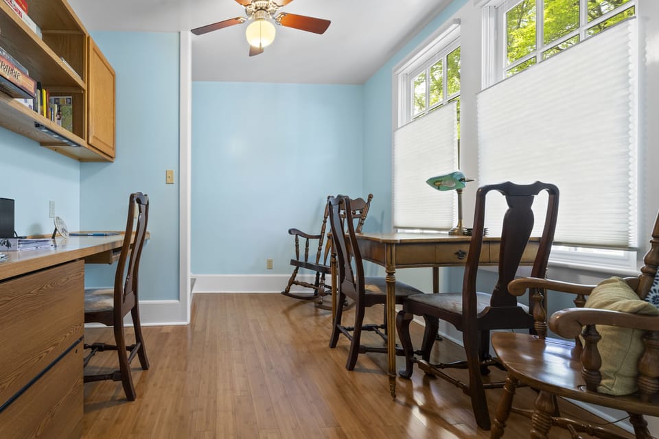 Office area with game table and rocking chairs to relax in