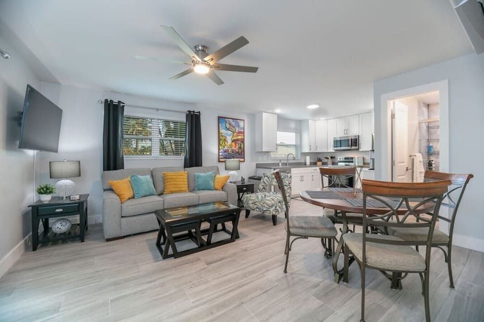 Open concept kitchen and living room with 54" smart TV