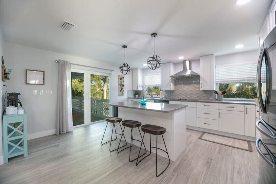 1 of 3 large eat in kitchens with coffee bar.