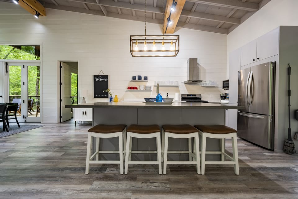 Four leather barstools at Kitchen Quartz Island.