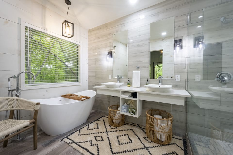 King en suite bathroom.  Soaking tub. Towel baskets.  Chair.