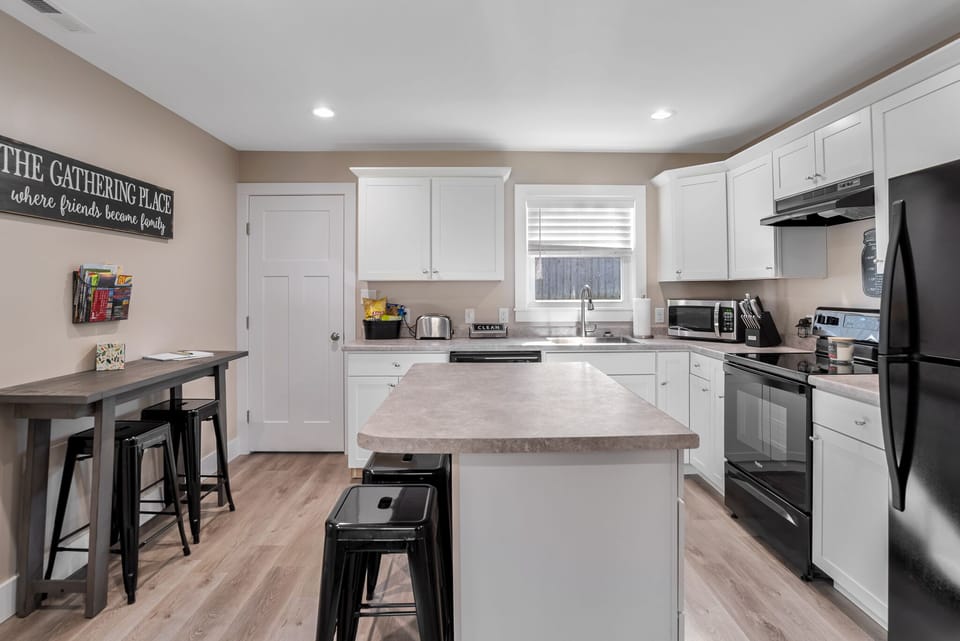 New kitchen with island, & automatic ice maker.
