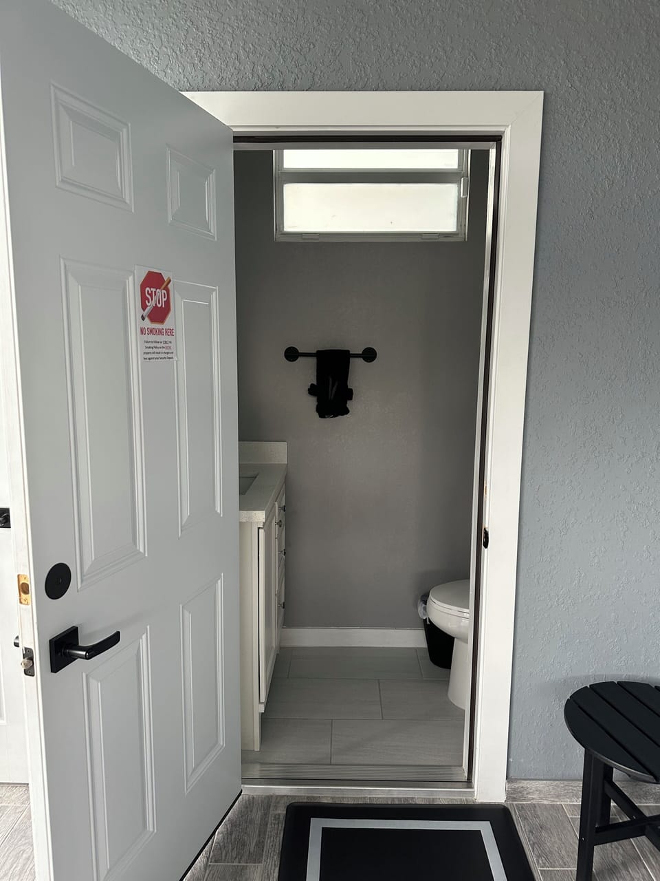Back lanai air-conditioned half- bathroom. 