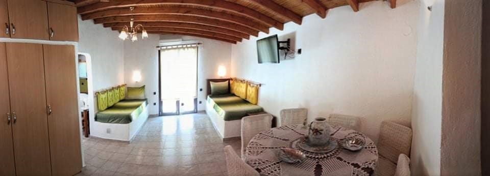 Villa | Living area | 30-inch TV with digital channels